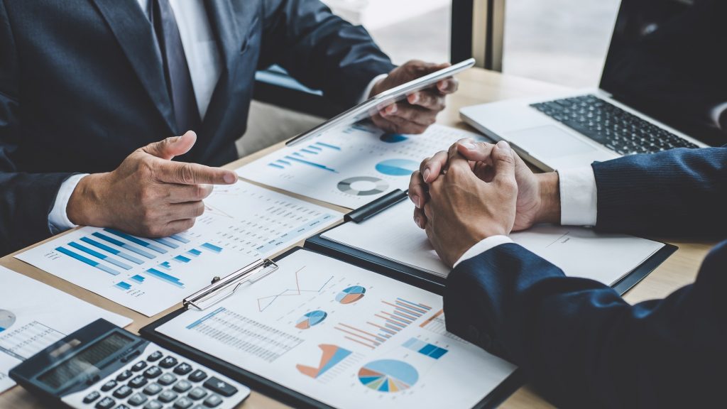 Finance manager meeting discussing company growth project success financial statistics